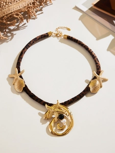 Leopard print cord necklace with gold starfish and seashell charms for beach vacation