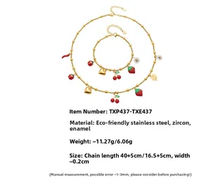 Detail of gold stainless steel jewelry set featuring colorful enamel nature pendants