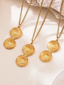 Detailed view of three gold-plated necklaces with textured double-helix infinity pendants