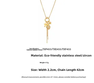 Detailansicht der goldenen Edelstahlkette mit Zirkon-Herz- und Kreuzanhängern