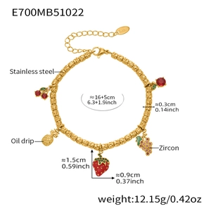 Detail of 18k gold plated stainless steel bracelet with colorful fruit charms and zircon