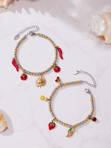 Detail of 18k gold plated stainless steel bead bracelets with colorful enamel charms