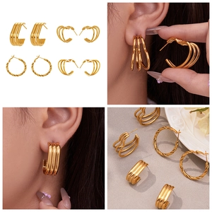 Detailed set of four 18k gold-plated stainless steel earrings featuring triple-layer hearts