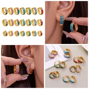 Detail of 18k gold plated hoop earrings featuring multi-color micro-pave cubic zirconia
