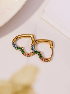 Detail of 18k gold heart earrings with colorful blue, green, and pink zircon stones