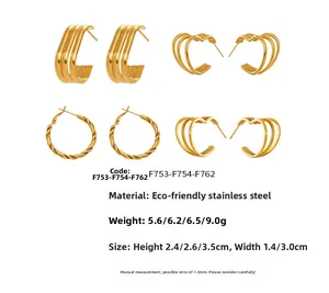 Detail of 18k gold plated stainless steel hoop earrings with triple layers and heart shapes