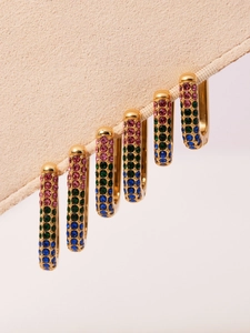 Detail of 18k gold-plated U-shaped earrings with colorful pavé cubic zirconia