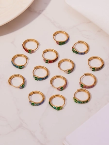 Macro shot of colorful zircon snake head hoop earrings with 18k gold plated finish