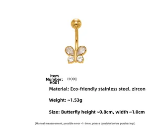 Detalle macro de piercing para ombligo mariposa bañado en oro 18k con circonitas