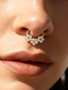 Close-up of titanium gold nose ring featuring 11 sparkling 5A cubic zirconia stones