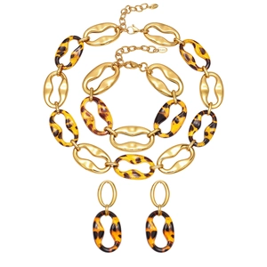 Vintage stainless steel jewelry set featuring leopard resin earrings necklace and bracelet