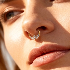 Titanium nose ring with gold plating and five marquise-cut white zircons for women