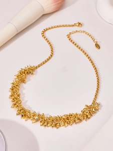 Detailed view of gold stainless steel necklace with heart pendants and lobster clasp