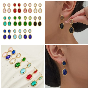 Detail of 18k gold plated double oval earrings featuring faceted gemstones in 15 colors