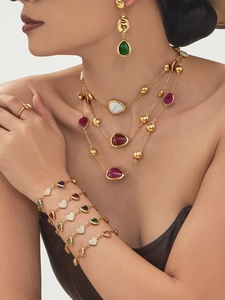 Detailed view of 18k gold plated jewelry set with colorful resin and 5A zircon hearts