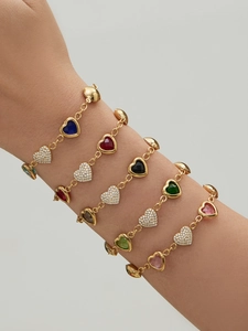 Detail of 18k gold-plated heart bracelets with colorful resin and 5A zircon stones
