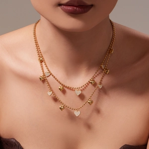 Double-layered 18k gold plated heart pendant necklace with shimmering zircon accents