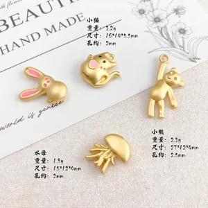 Golden alloy animal pendants including rabbit, cat, and jellyfish for DIY jewelry making