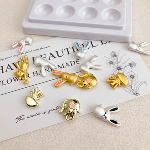 Detail of assorted animal charms in gold and silver finish for DIY jewelry making