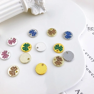 DIY jewelry pendants with colorful rhinestones in gold and silver finishes on tray