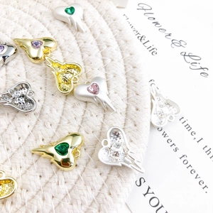 DIY alloy heart pendants with crystal centers and small wings in gold and silver finish