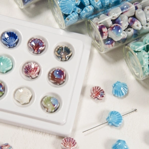 Assorted colorful shell ceramic beads for DIY jewelry making in various pastel shades