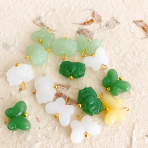 Faux jade lotus and butterfly pendants with gold loops for DIY jewelry making