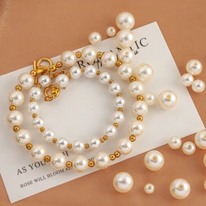 Elegant white faux pearl necklace and bracelet set with gold T-bar toggle clasp jewelry
