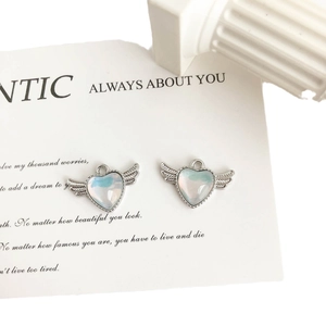 Pair of silver heart wing charms with pearlescent resin inlay for DIY jewelry