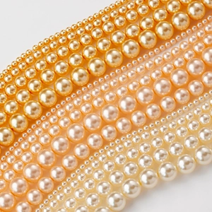 Perlas de cristal pulido en colores champán y crema para la creación de joyas DIY