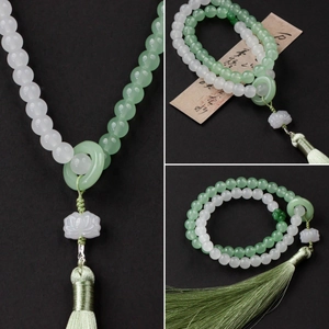 Faux jade lotus tassel pendant with green beads and silk fringe in classical style