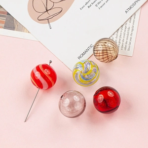 Set of colorful handmade hollow glass beads for DIY jewelry making and earrings