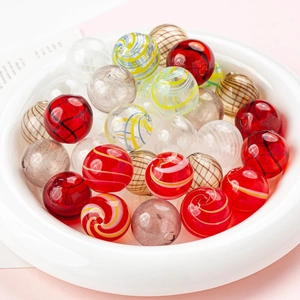Macro view of 12mm handmade hollow glass beads with colorful spiral stripes for DIY jewelry