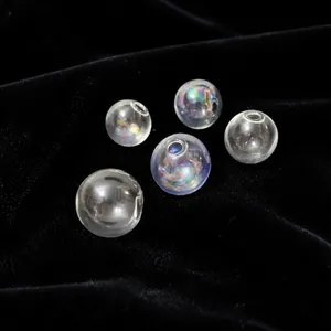 Macro detail of iridescent glass bubble beads with holes for DIY jewelry making