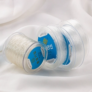 Macro view of 1.0mm transparent elastic PU string for jewelry beading and DIY crafts