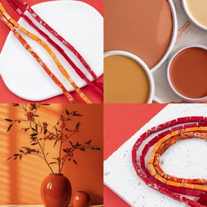 Macro detail of natural imperial jasper tube beads in vibrant red and orange tones