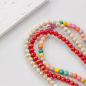 Close-up of vibrant 4-12mm gold-speckled natural gemstone beads for DIY jewelry making