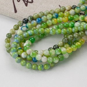 Polished green natural jade round beads 4-12mm for DIY necklace making on white leather