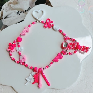 Barbie style pink and white beaded pendant with resin charms and heart carabiner