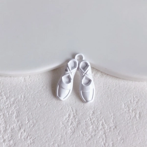 Detail of white ballet shoe alloy pendant charm with glossy finish for DIY jewelry crafts