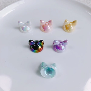 Iridescent acrylic bow ear charms for DIY crafts in multiple pearlescent colors