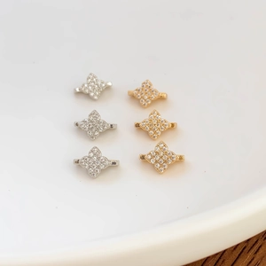 Gold and silver plated four-petal flower spacer beads with micro-pave cubic zirconia