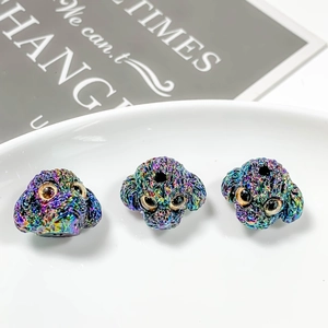 Macro shot of colorful iridescent dog charms for DIY jewelry making and bead necklaces