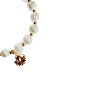 Elegant gold-plated pearl bracelet with sunburst charm and metallic bead spacers