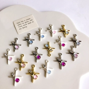 Detailed view of colorful zircon-studded alloy cross charms for DIY jewelry making