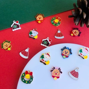 DIY Christmas charms featuring Santa and reindeer with vibrant enamel finish for jewelry