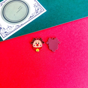 Detailed front and back view of a cartoon reindeer enamel charm for DIY holiday jewelry