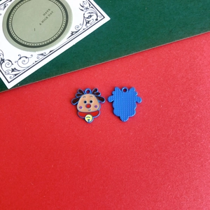 Detailed view of blue cartoon reindeer charms with red nose and bell for DIY Christmas decor
