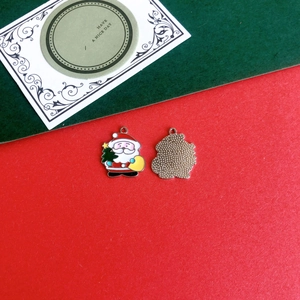 Front and back detail of Santa Claus enamel charms for festive Christmas DIY accessories
