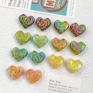 Macro shot of 14 colorful resin heart beads with rose texture for DIY jewelry making